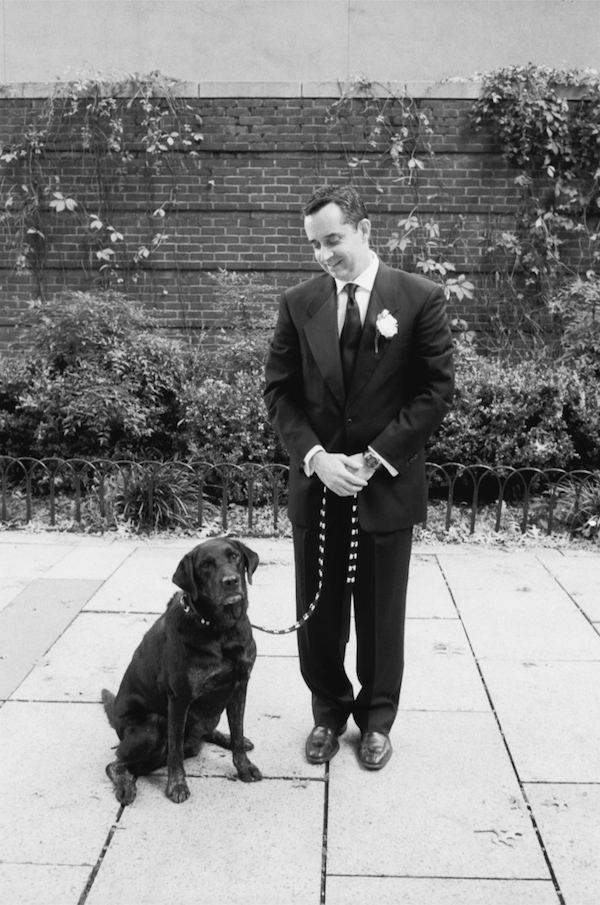 photo by New York City based wedding photographer Karen Hill - black and white photo of groom and labrador 